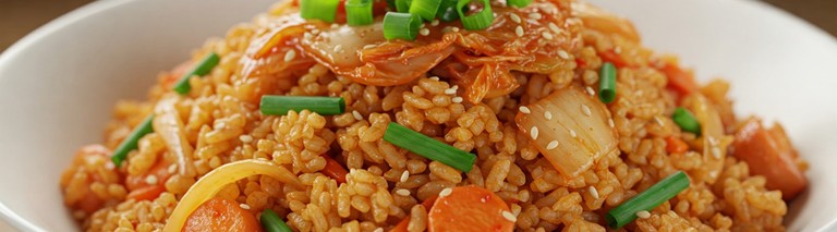 A vibrant and close up image of a freshly cooked, steamy bowl of Kimchi Fried Rice with visible colorful ingredients and garnish.